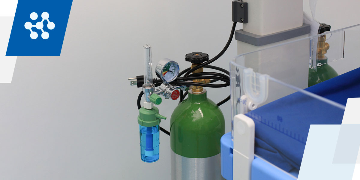 an oxygen cylinder with a gauge attached to it
