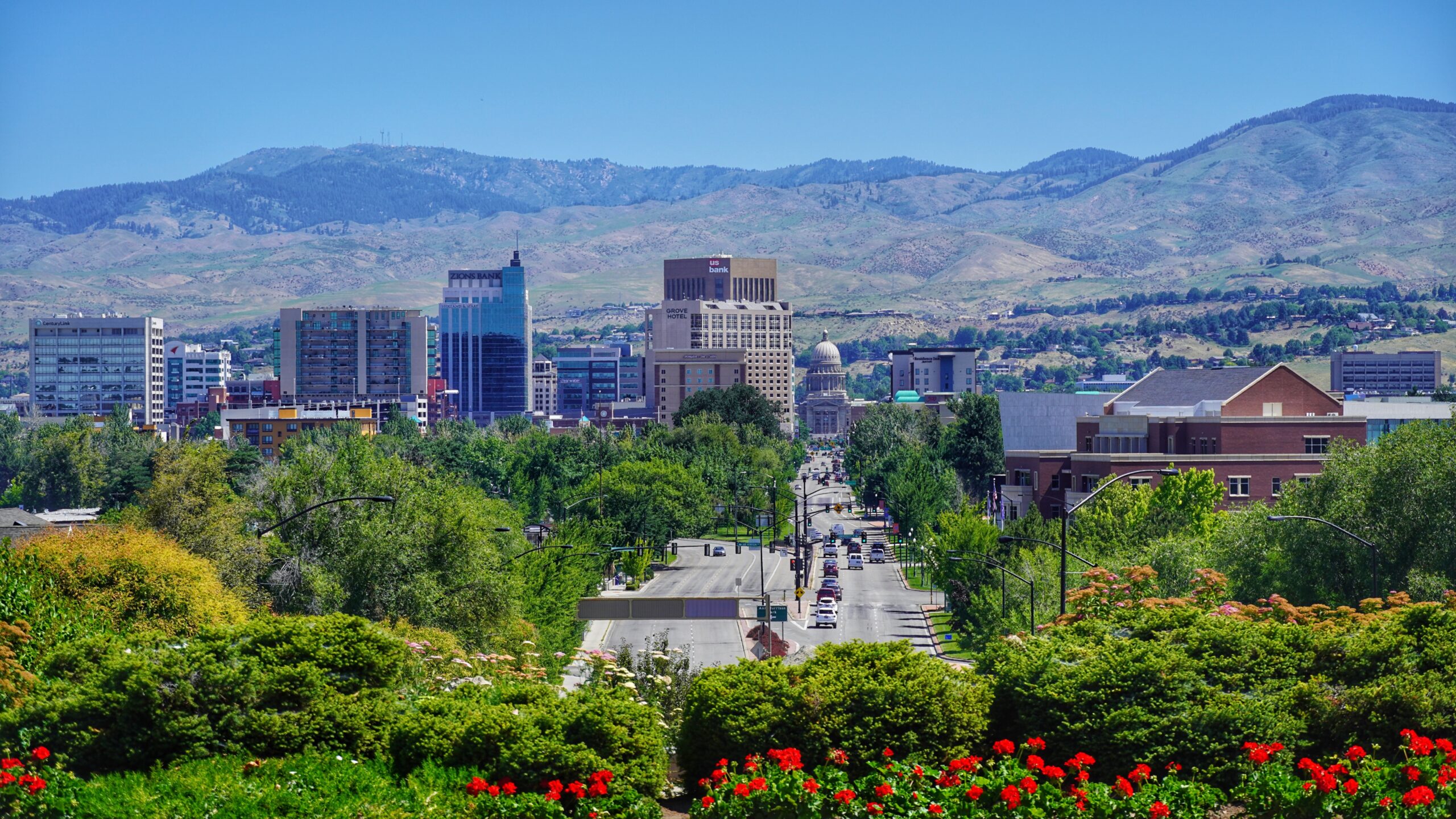 a view of a city with mountains in the background