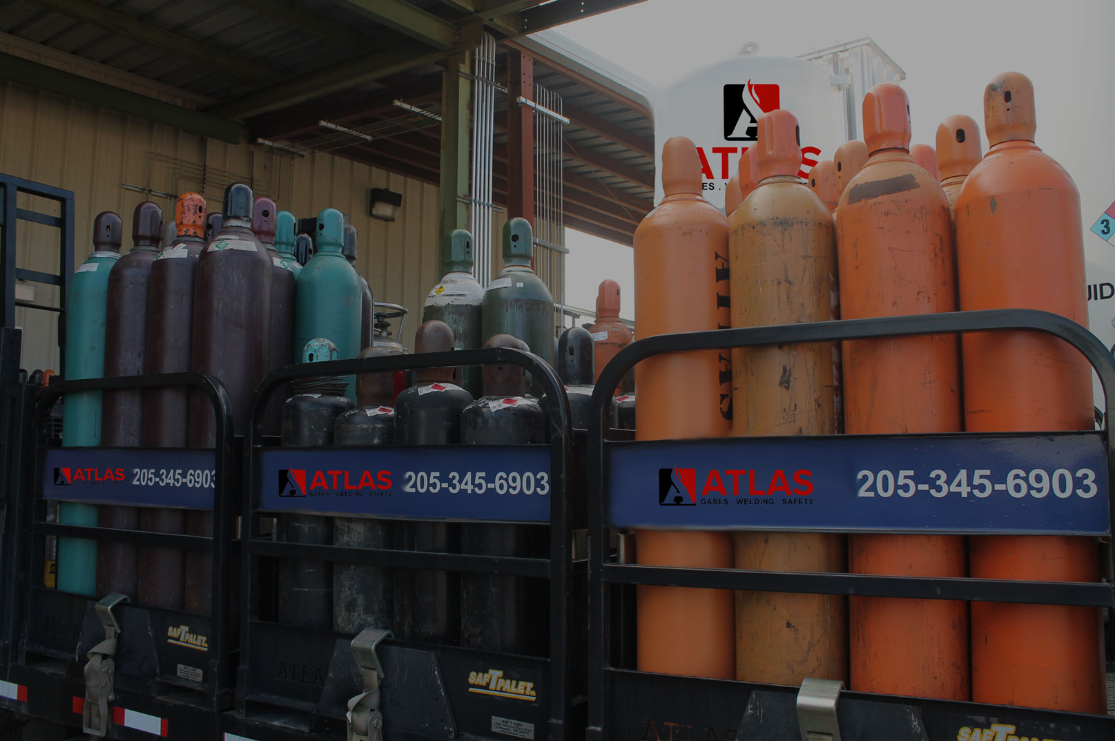 a bunch of gas cylinders are stacked on top of each other