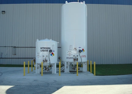 two white tanks with nitrogen liquid written on them