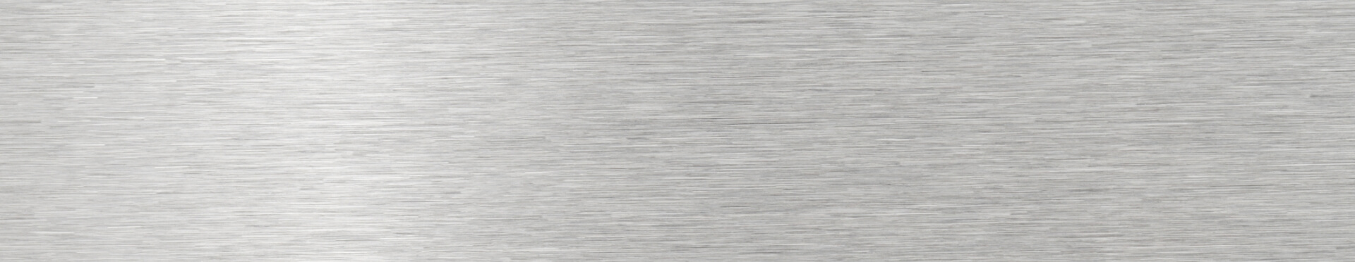 a close up of a stainless steel surface with a brushed finish.